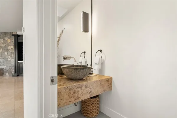 a spacious bathroom with sinks mirror and a bathtub