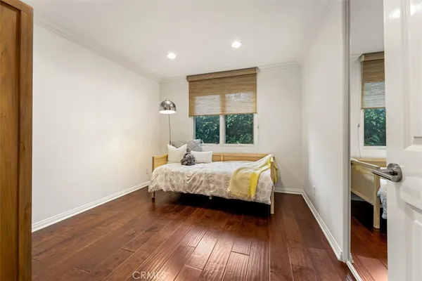 a view of living room with kitchen island and stainless steel appliances
