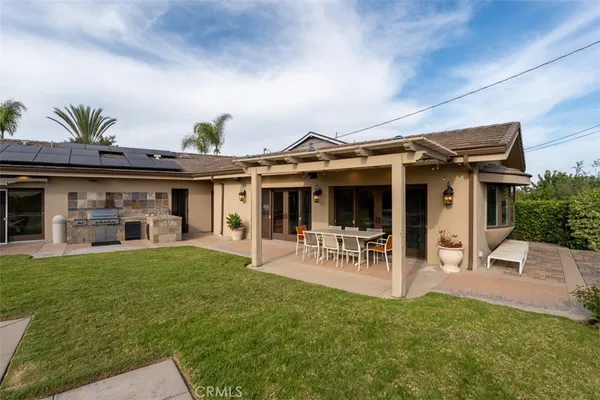 an aerial view of a house with a garden
