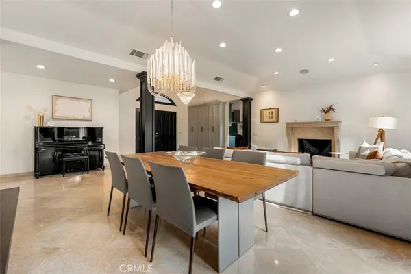 a kitchen with a sink cabinets and wooden floor