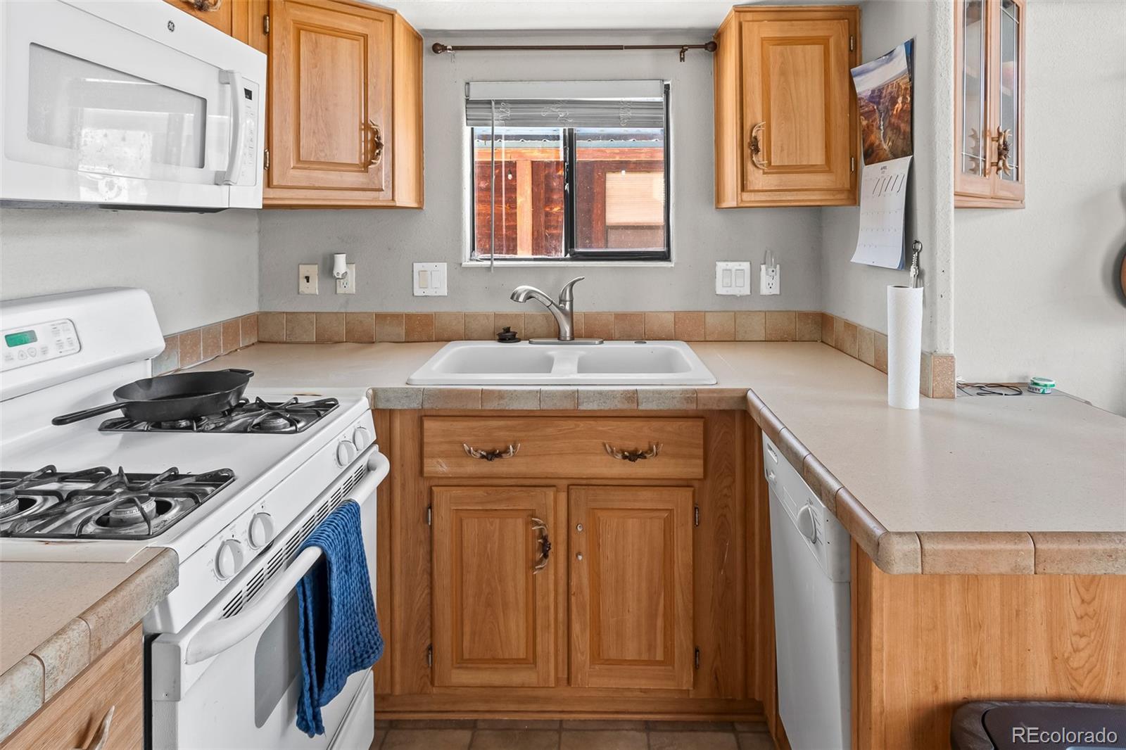 92 Sunshine Loop Fairplay, CO 80440 - Photo 19 of 30 a kitchen with stainless steel appliances granite countertop a sink stove and cabinets