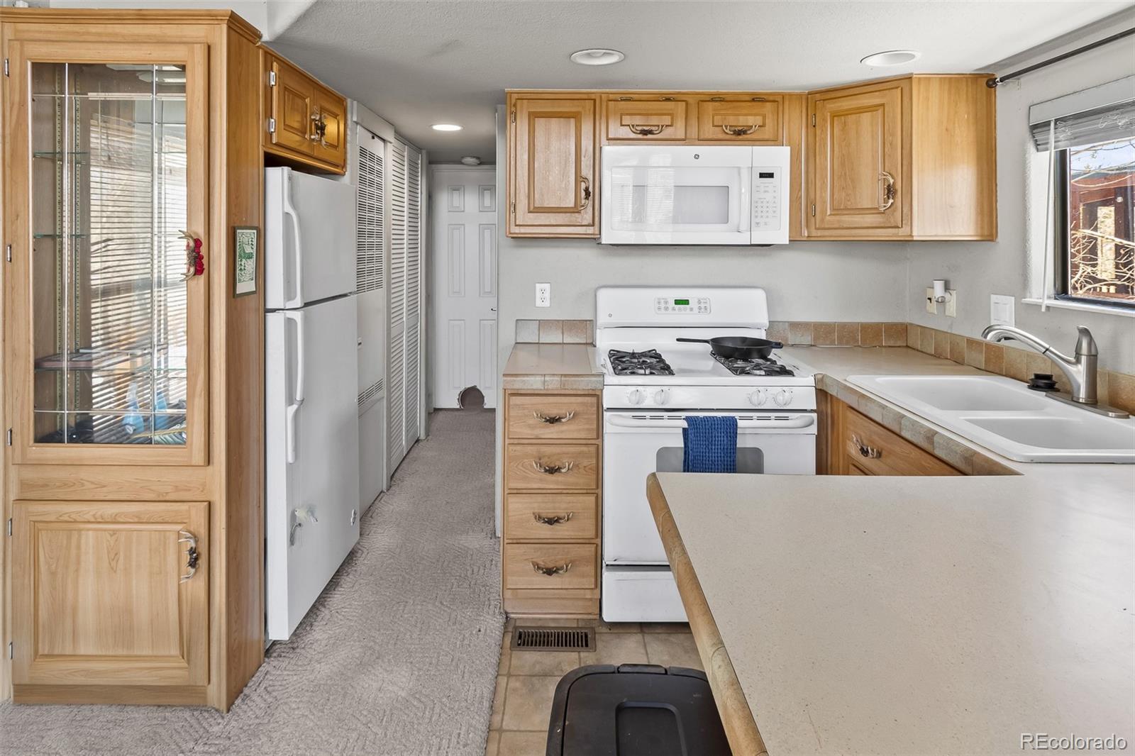 92 Sunshine Loop Fairplay, CO 80440 - Photo 20 of 30 a kitchen with stainless steel appliances granite countertop a stove a sink and a refrigerator