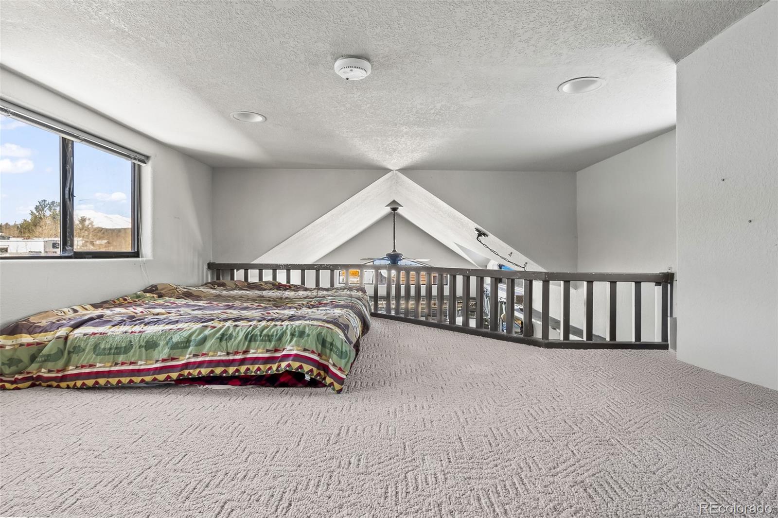 92 Sunshine Loop Fairplay, CO 80440 - Photo 25 of 30 a view of a bedroom with furniture and staircase