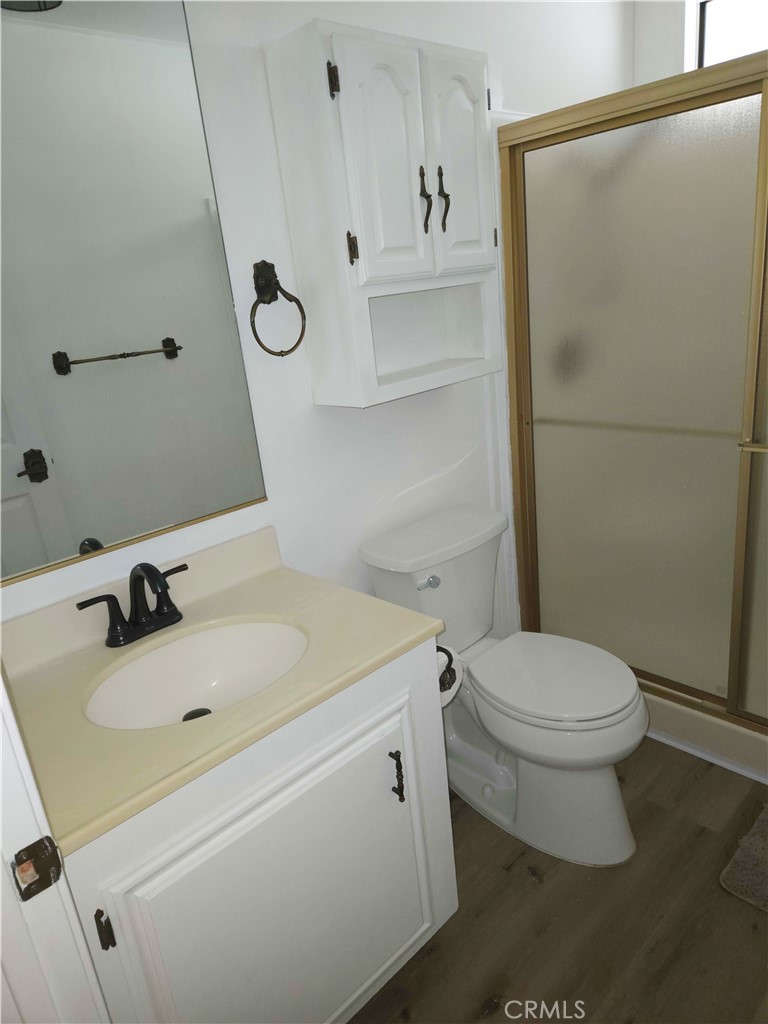 840 East Foothill Boulevard, Unit 203 Azusa, CA 91702 - Photo 11 of 21 a bathroom with a sink and mirror with toilet