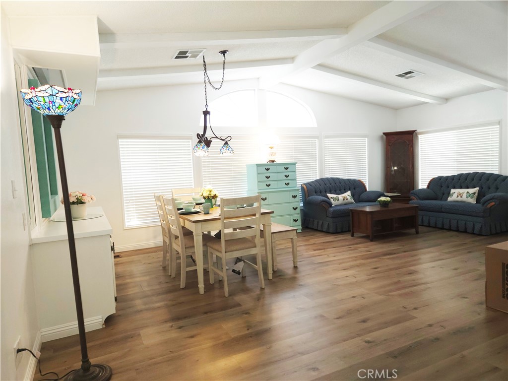 840 East Foothill Boulevard, Unit 203 Azusa, CA 91702 - Photo 12 of 21 a view of a dining room with furniture and wooden floor