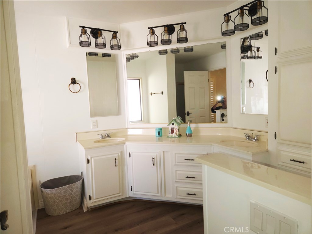 840 East Foothill Boulevard, Unit 203 Azusa, CA 91702 - Photo 18 of 21 a spacious bathroom with a double vanity sink and mirror