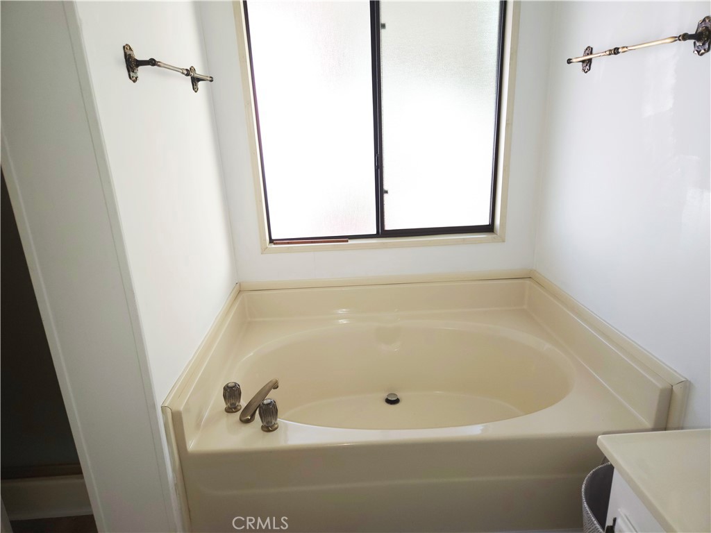 840 East Foothill Boulevard, Unit 203 Azusa, CA 91702 - Photo 19 of 21 a white bath tub sitting next to a window
