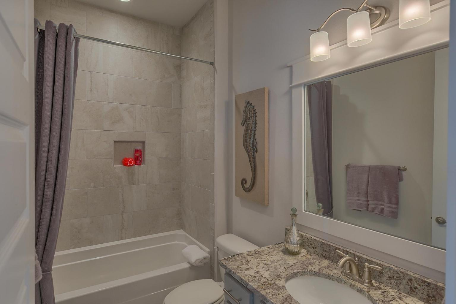 65 Pine Lands Loop Inlet Beach East, Unit C Inlet Beach, FL 32461 - Photo 15 of 47 a bathroom with a granite countertop shower sink vanity and toilet