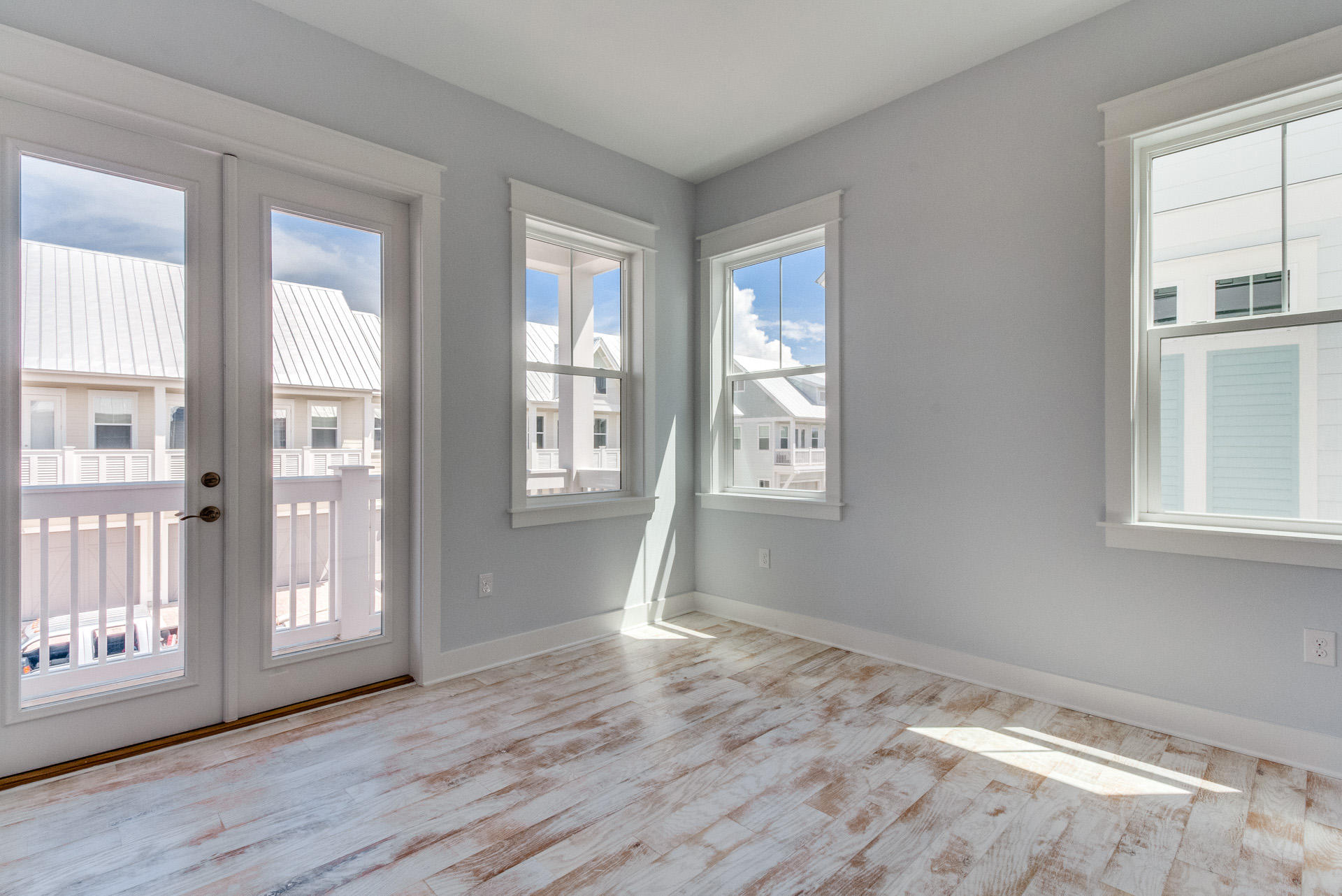 65 Pine Lands Loop Inlet Beach East, Unit C Inlet Beach, FL 32461 - Photo 32 of 47 a view of livingroom with hardwood floor and windows