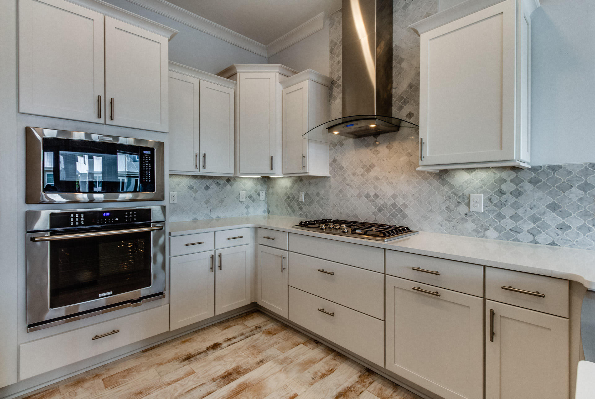 65 Pine Lands Loop Inlet Beach East, Unit C Inlet Beach, FL 32461 - Photo 35 of 47 a kitchen with stainless steel appliances granite countertop a stove a microwave and sink