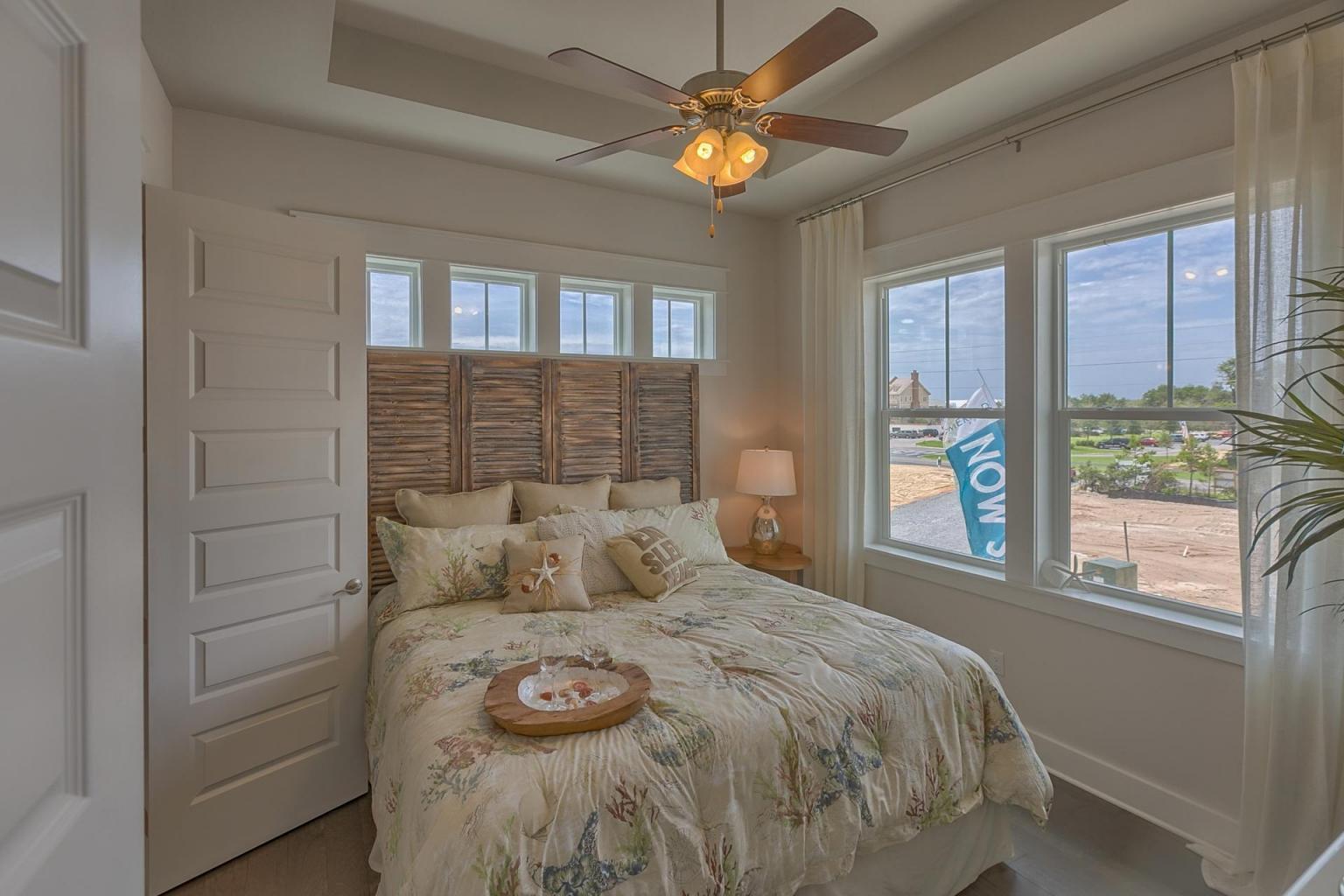 65 Pine Lands Loop Inlet Beach East, Unit C Inlet Beach, FL 32461 - Photo 9 of 47 a bedroom with a bed and a window