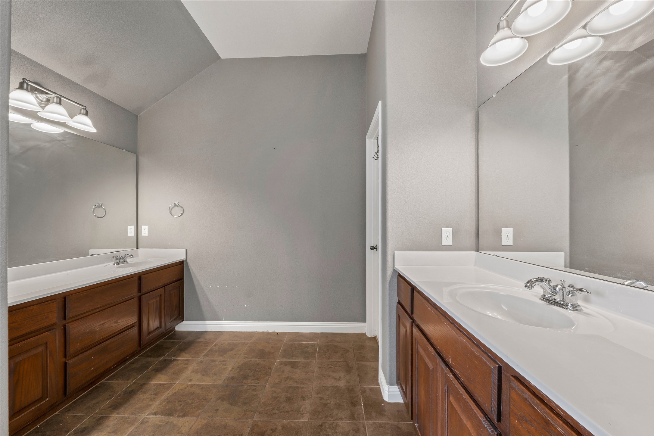 1102 Canyon Maple Road Pflugerville, TX 78660 - Photo 11 of 21 a bathroom with a double vanity sink and a mirror