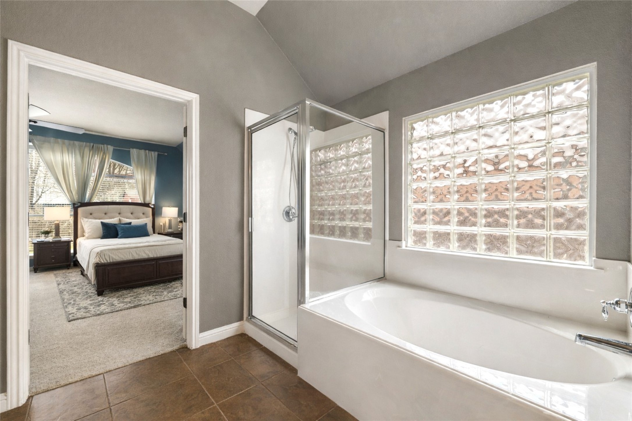 1102 Canyon Maple Road Pflugerville, TX 78660 - Photo 12 of 21 a spacious bathroom with a tub and a large window