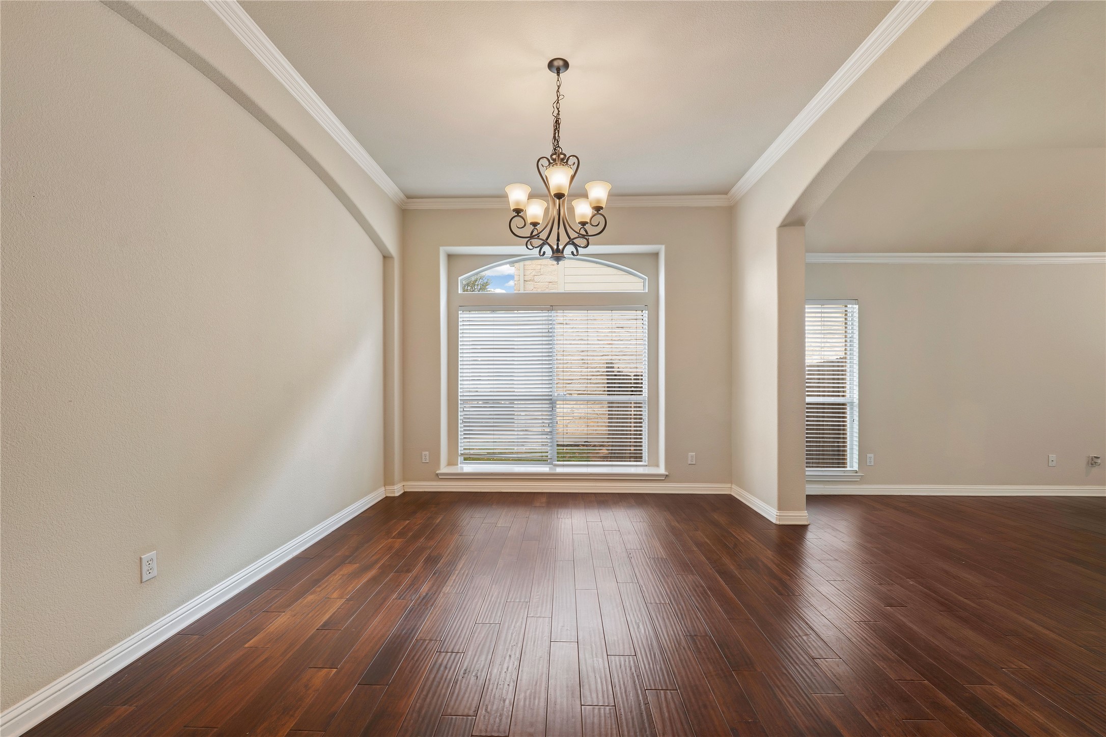 1102 Canyon Maple Road Pflugerville, TX 78660 - Photo 5 of 21 wooden floor in an empty room with a window