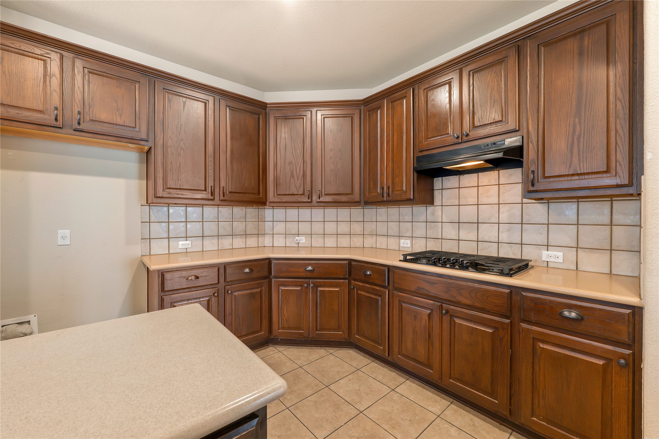 1102 Canyon Maple Road Pflugerville, TX 78660 - Photo 7 of 21 a kitchen with stainless steel appliances granite countertop a sink stove and cabinets