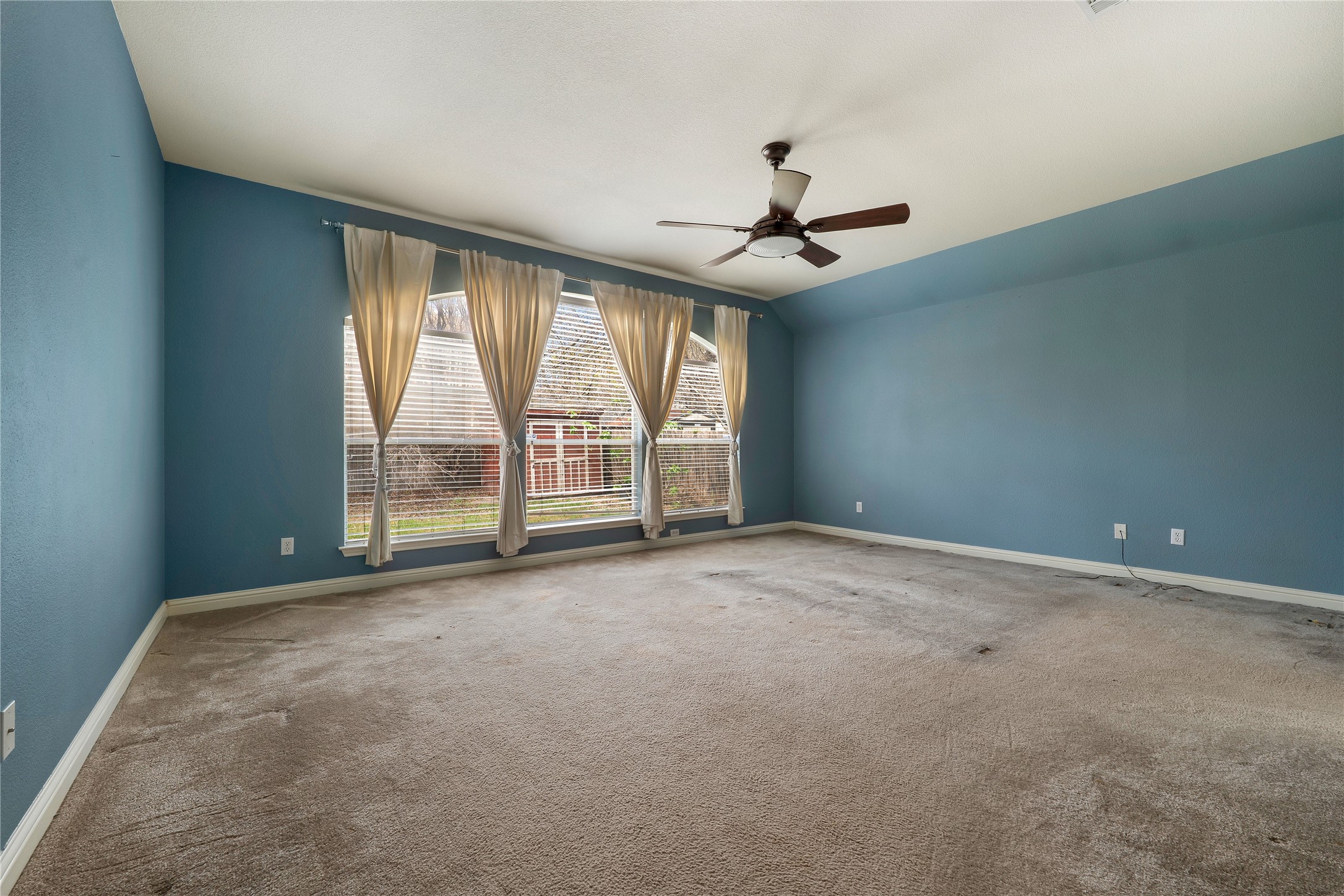 1102 Canyon Maple Road Pflugerville, TX 78660 - Photo 10 of 21 an empty room with windows and ceiling fan
