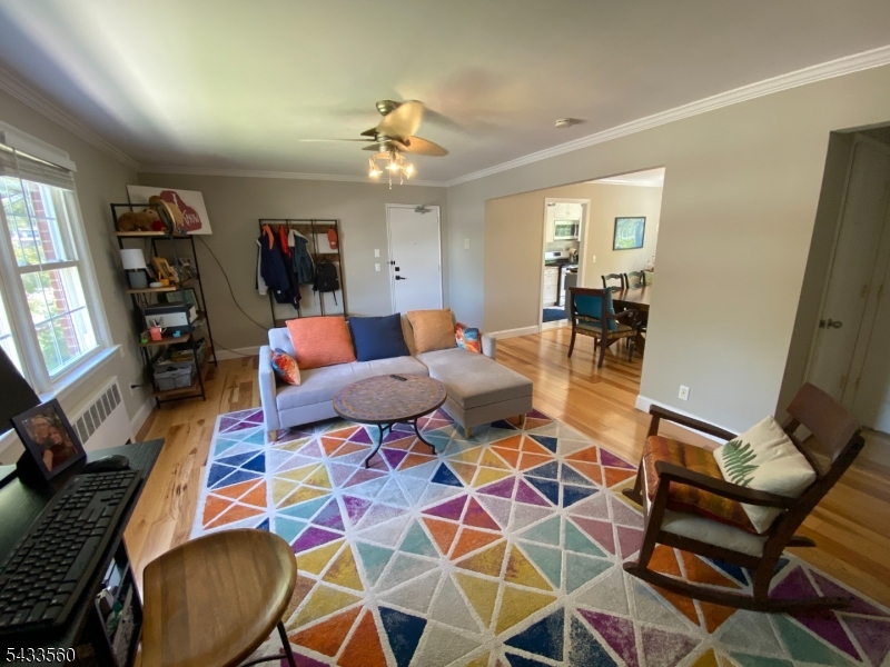 390 Morris Avenue, Unit 4 Summit, NJ 07901 - Photo 1 of 11 a living room with furniture and a flat screen tv