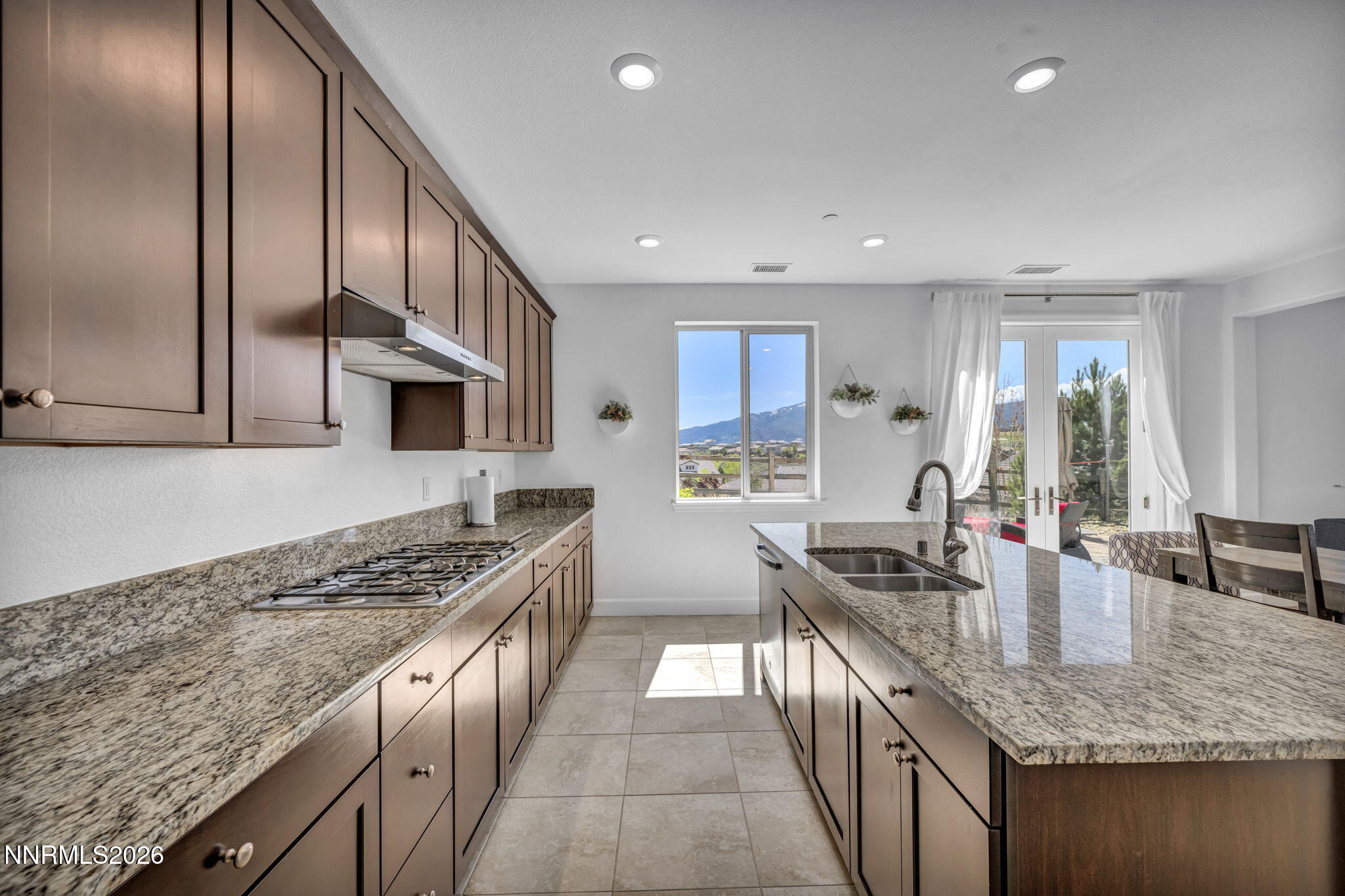 1785 Verdi Vista Court Reno, NV 89523 - Photo 11 of 35 a kitchen with stainless steel appliances granite countertop a sink stove and refrigerator
