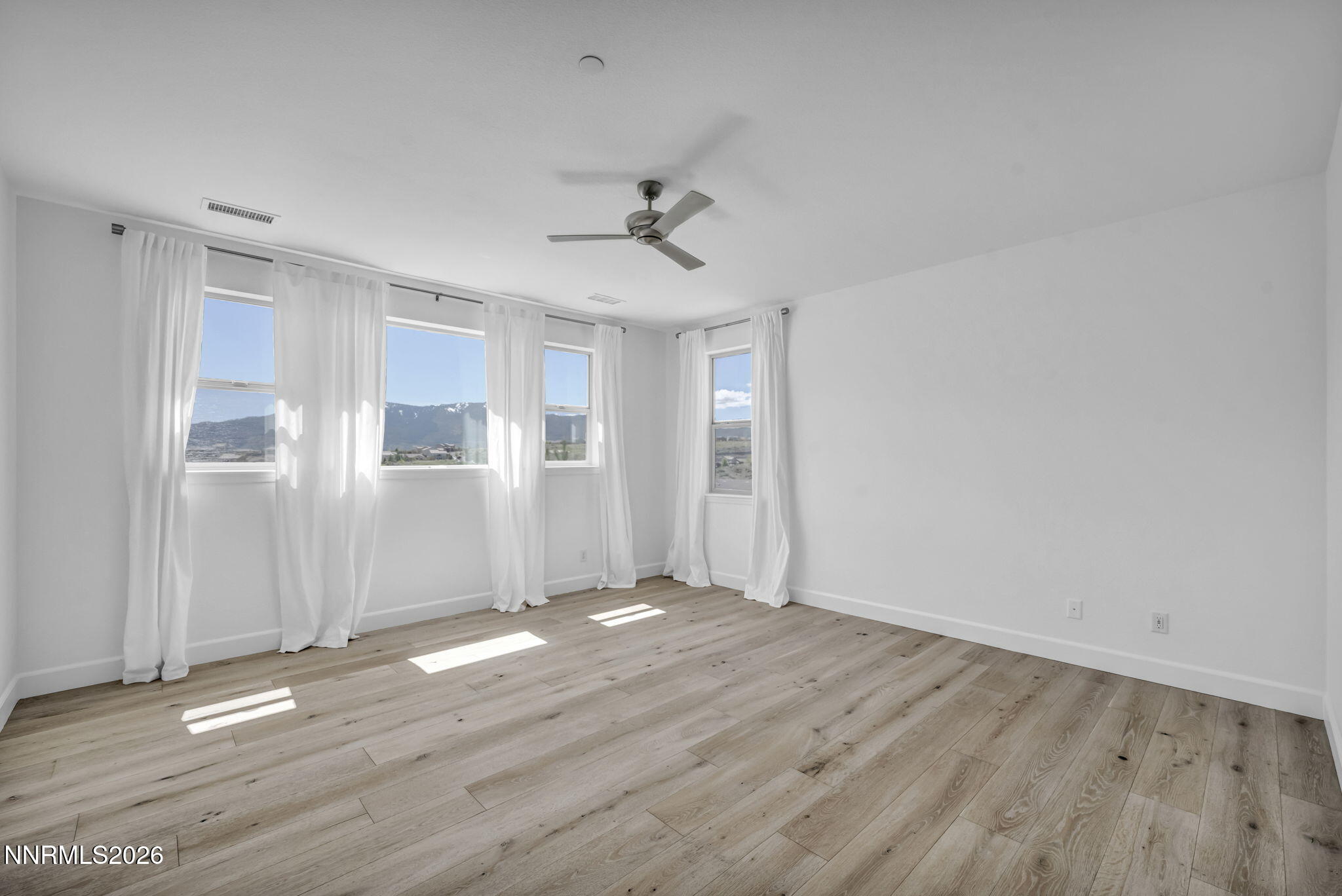 1785 Verdi Vista Court Reno, NV 89523 - Photo 12 of 35 wooden floor in an empty room with a window