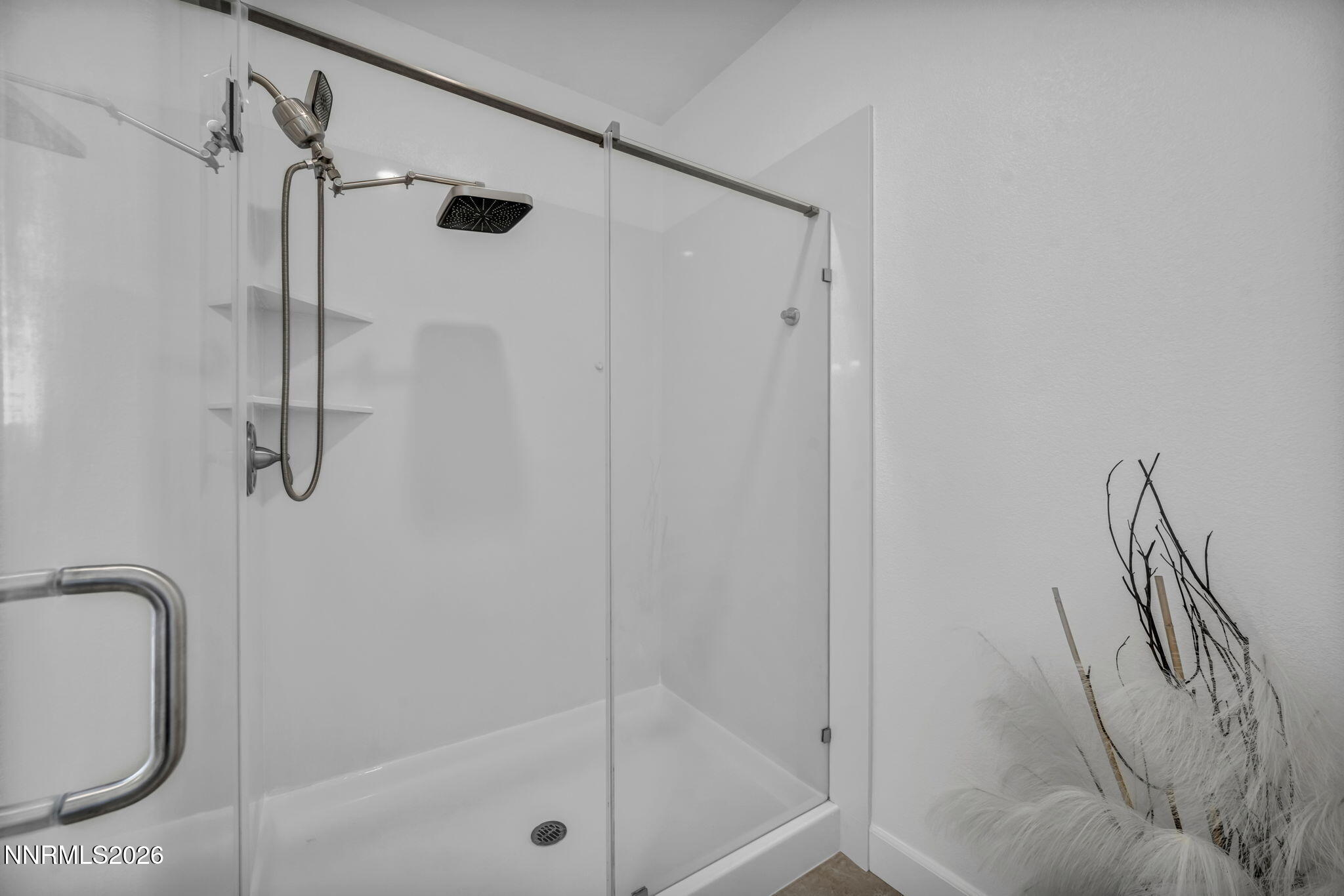 1785 Verdi Vista Court Reno, NV 89523 - Photo 16 of 35 a bathroom with a granite countertop shower a mirror and a sink