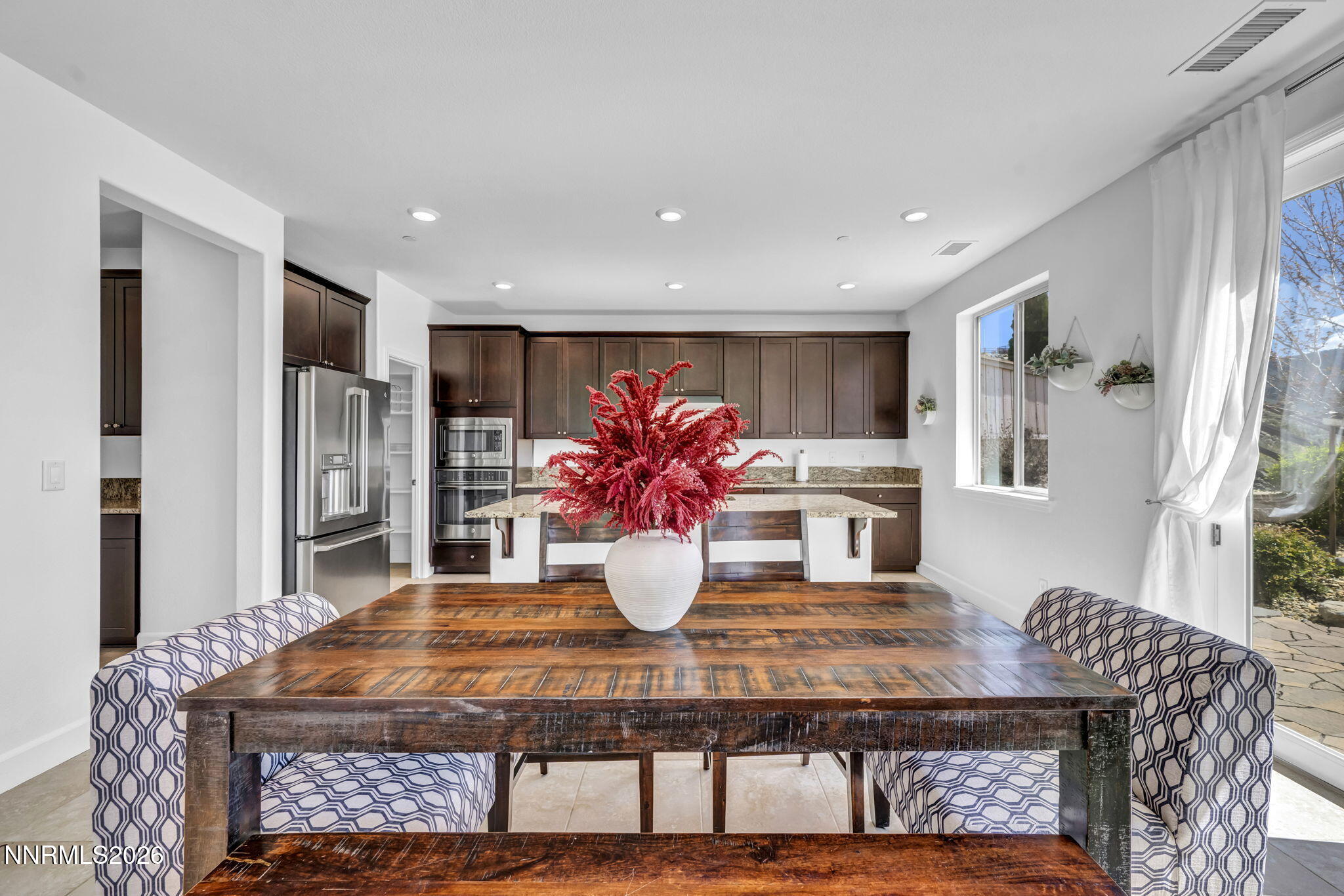 1785 Verdi Vista Court Reno, NV 89523 - Photo 9 of 35 a view of a dining room with furniture and chandelier
