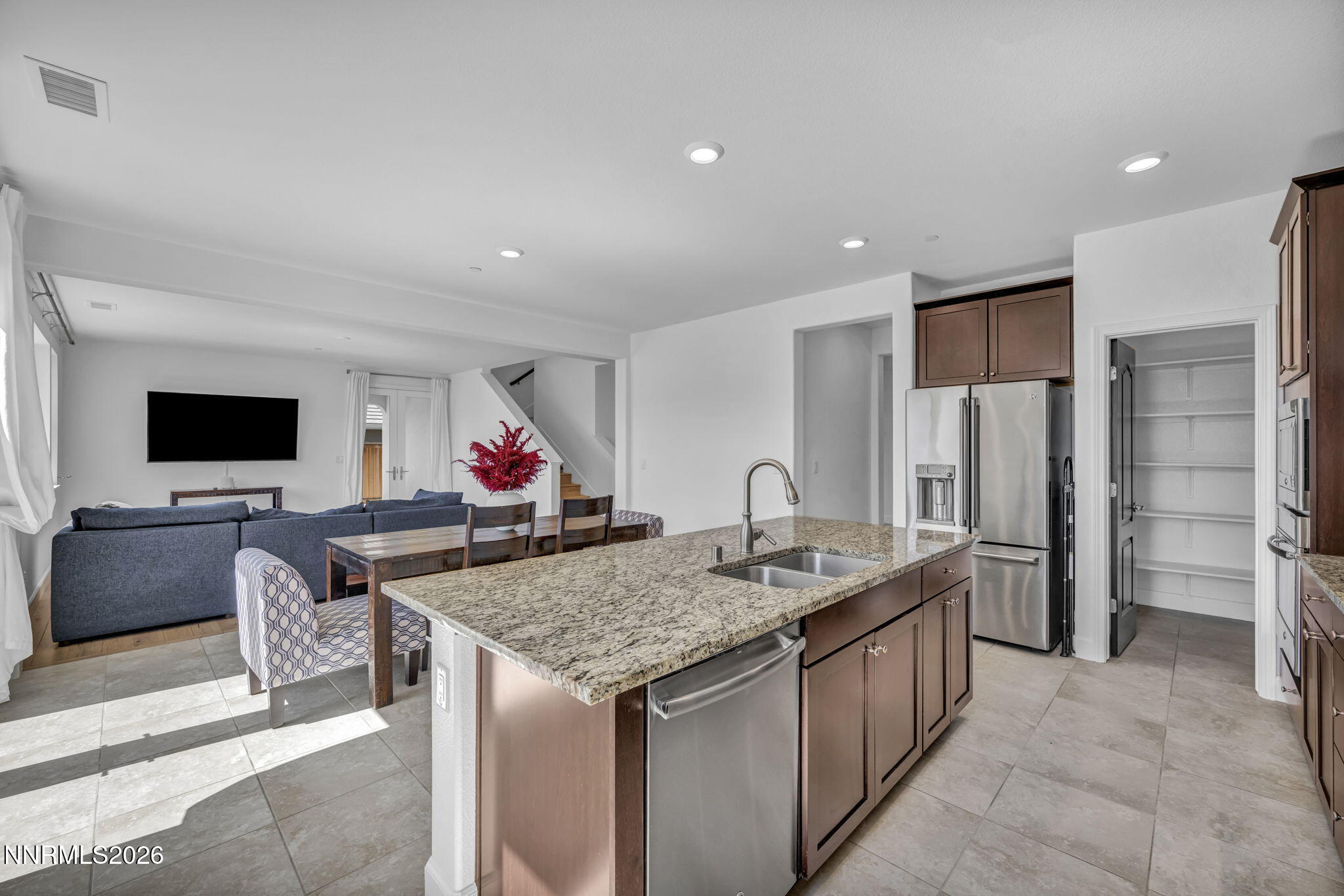 1785 Verdi Vista Court Reno, NV 89523 - Photo 10 of 35 a kitchen with stainless steel appliances granite countertop a sink and a refrigerator