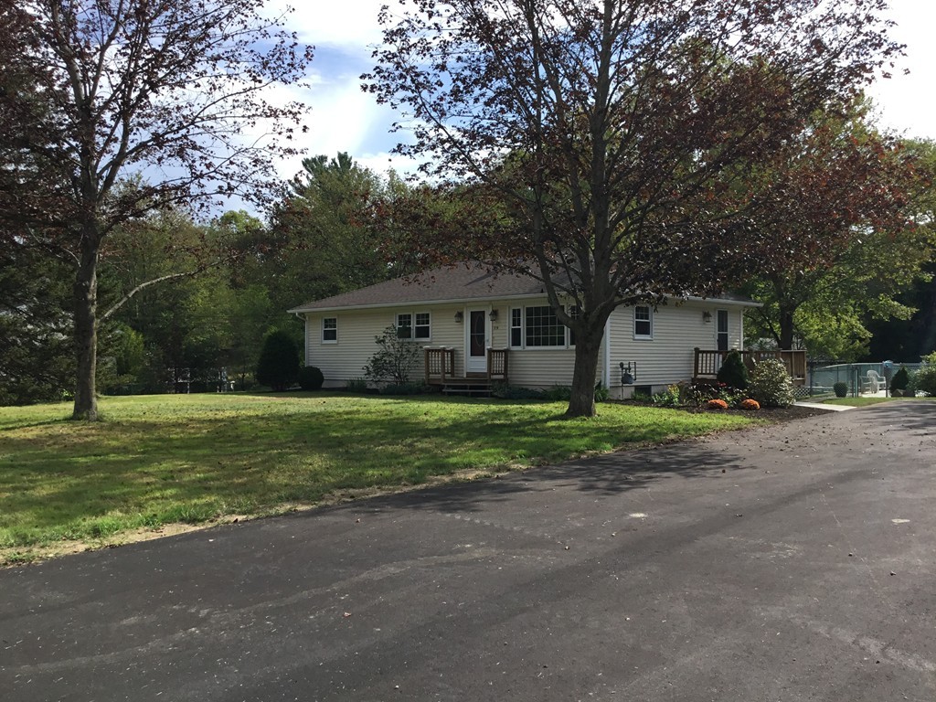 29 Boston Road Sutton, MA 01590 - Photo 1 of 16 a view of a house with a backyard