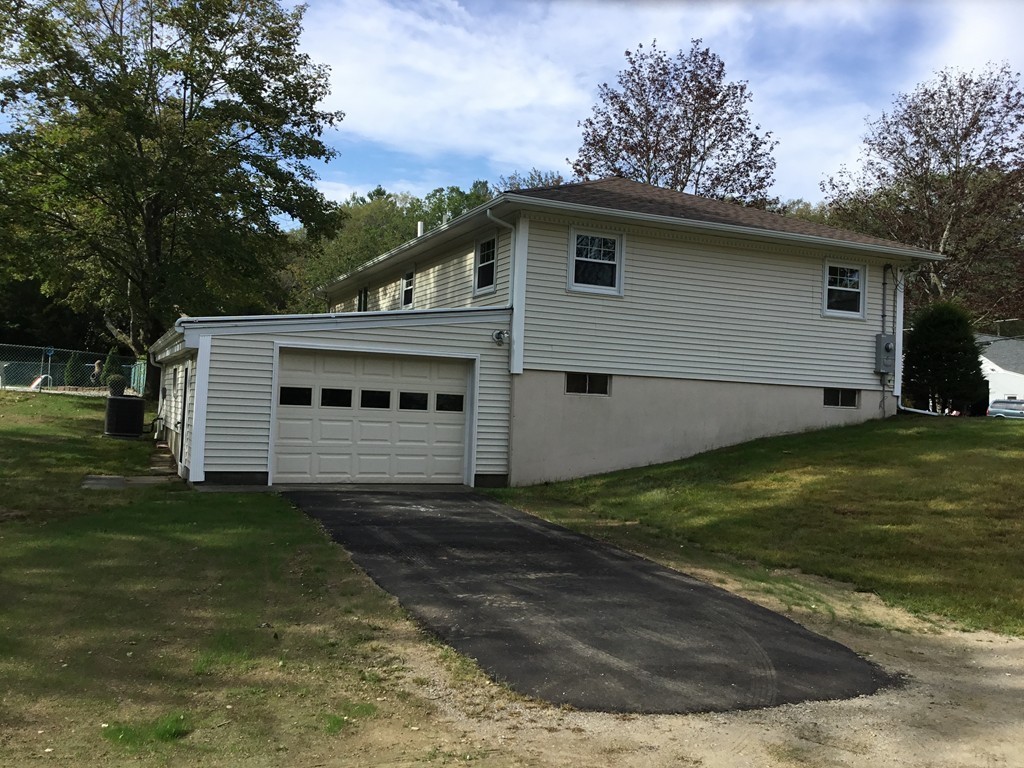 29 Boston Road Sutton, MA 01590 - Photo 3 of 16 a view of a house with a yard