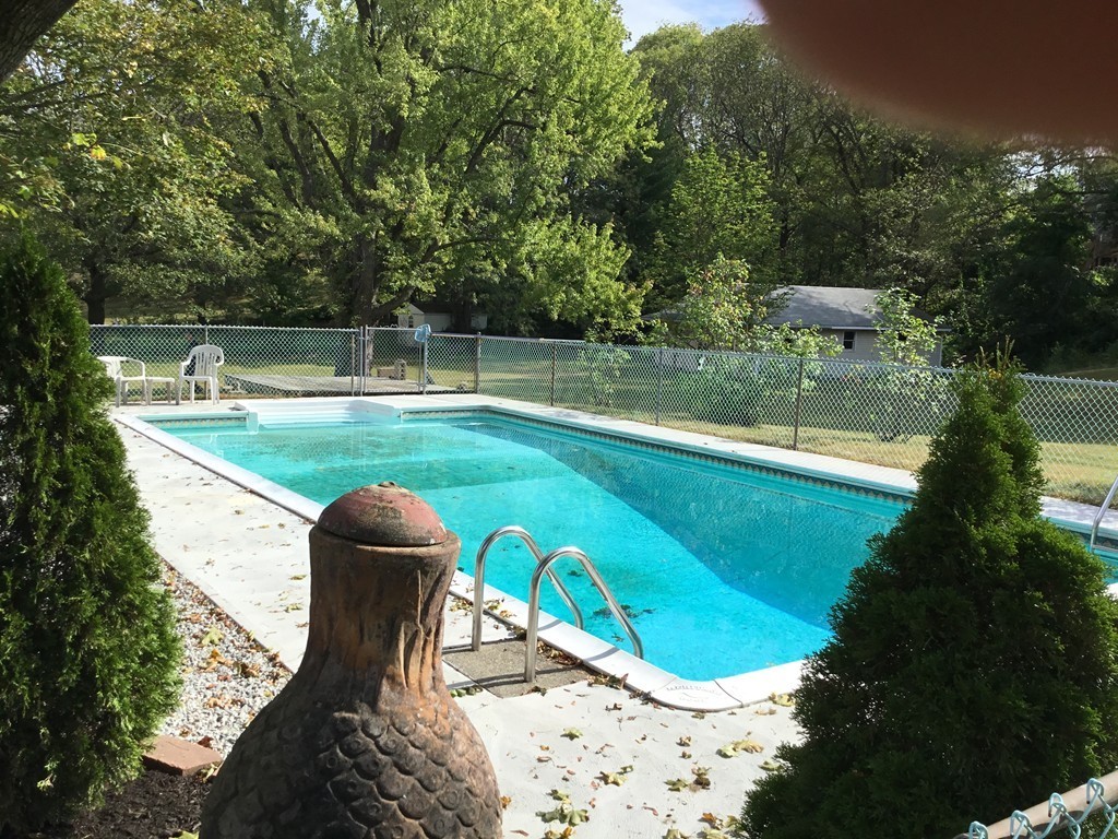 29 Boston Road Sutton, MA 01590 - Photo 5 of 16 a view of a wooden deck with a yard