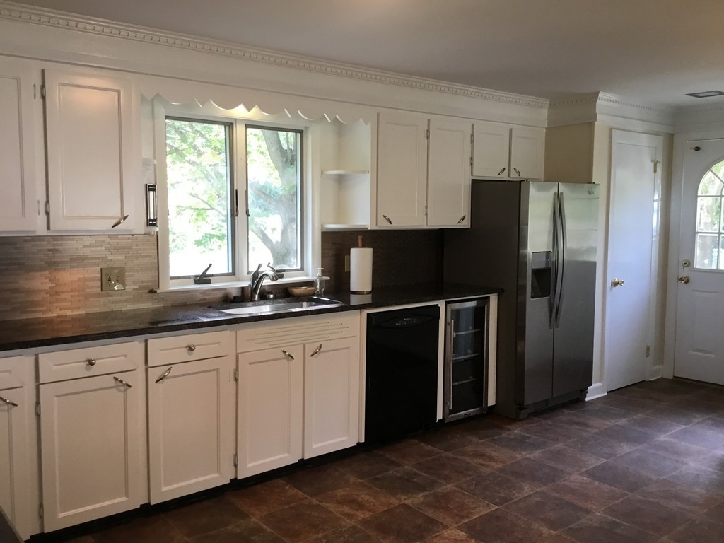 29 Boston Road Sutton, MA 01590 - Photo 9 of 16 a kitchen with stainless steel appliances granite countertop a refrigerator and a sink