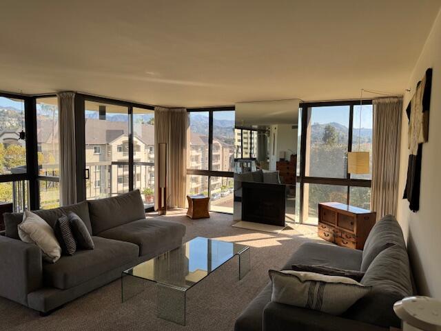 222 Monterey Road, Unit 306 Glendale, CA 91206 - Photo 1 of 32 a living room with furniture and a large window
