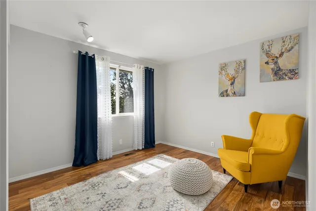 a bedroom with a bed and a couch