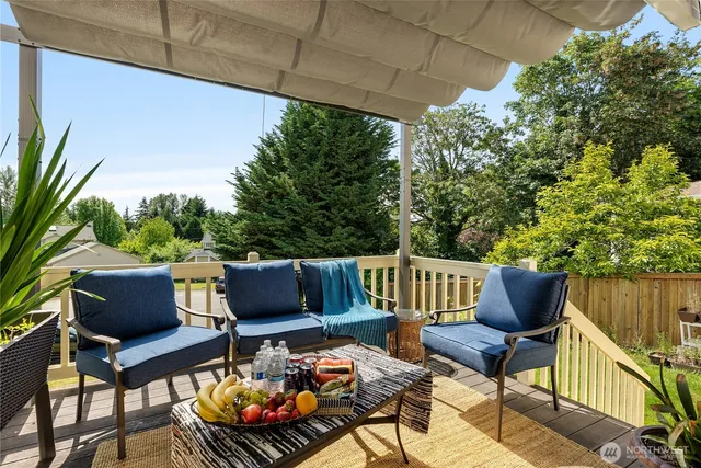 a view of sitting area with furniture and wooden bench