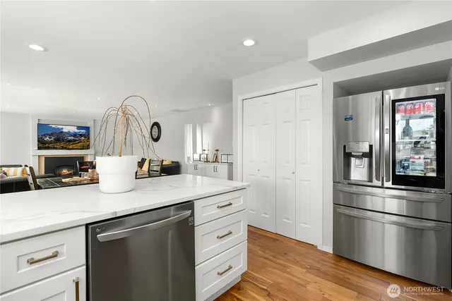 a kitchen with a sink and a refrigerator