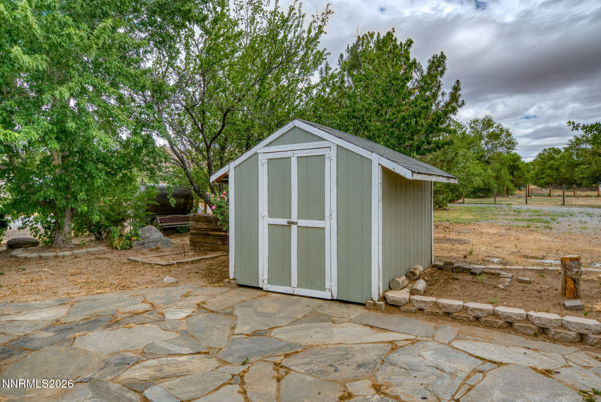 11577 Deodar Way Reno, NV 89506 - Photo 31 of 58 a front view of a house with garden