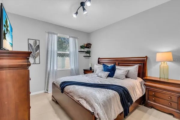 a bedroom with bed and window