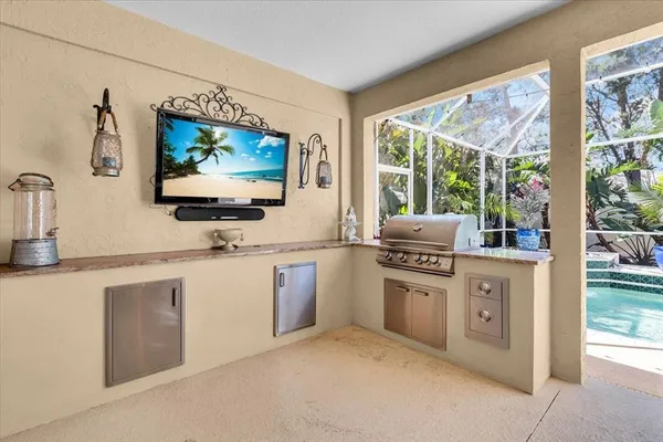 a kitchen with stainless steel appliances granite countertop a stove and a sink
