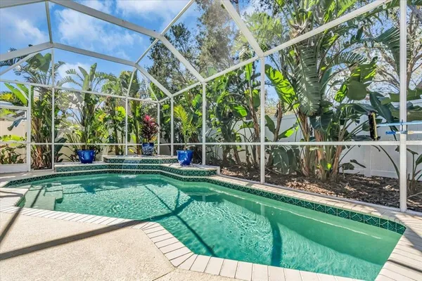 a view of a backyard with sitting area