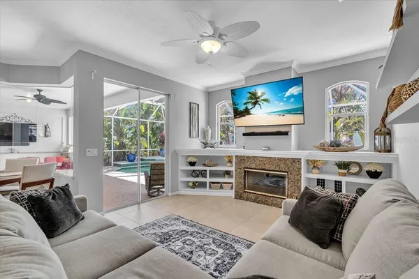 a living room with furniture and a fireplace