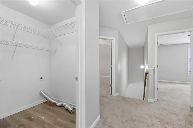 an empty room with windows and entrance