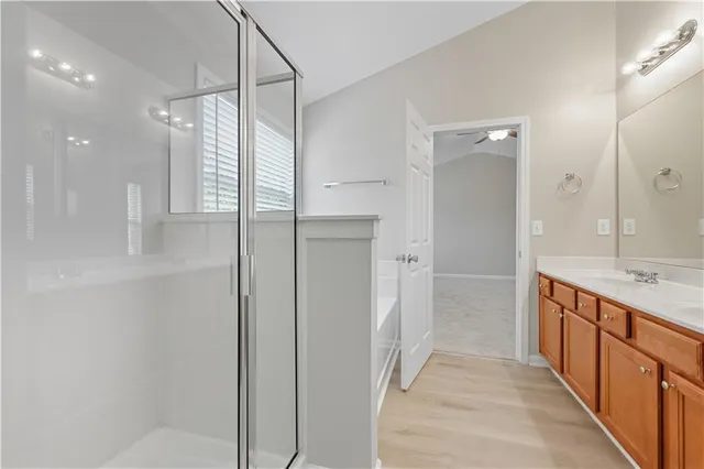 a view of a livingroom with a ceiling fan and window