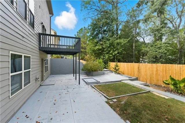 a view of backyard with a patio