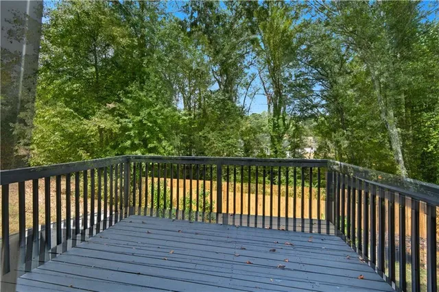 a view of balcony with wooden floor