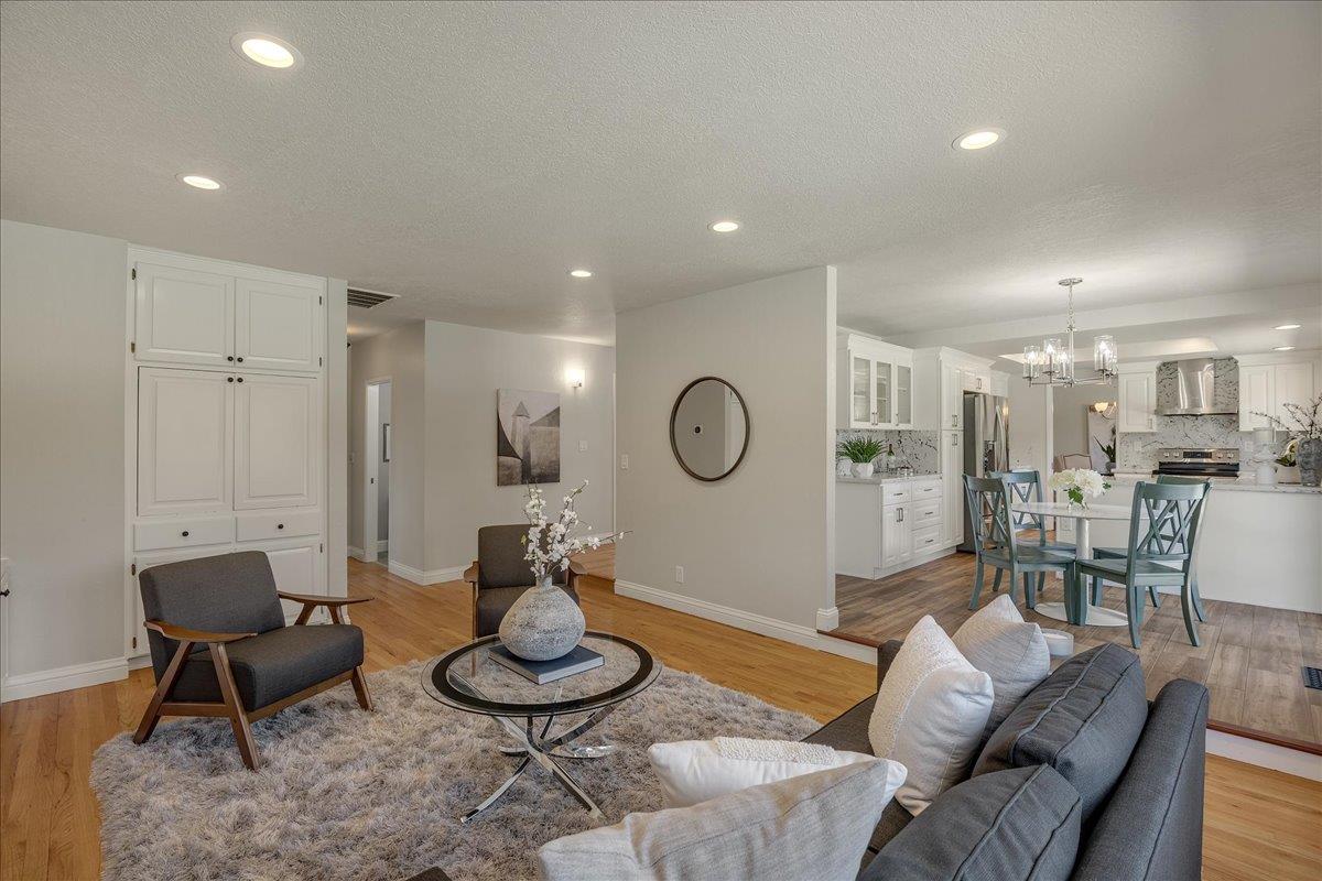 1204 Lubich Drive Mountain View, CA 94040 - Photo 11 of 39 a living room with furniture and a rug