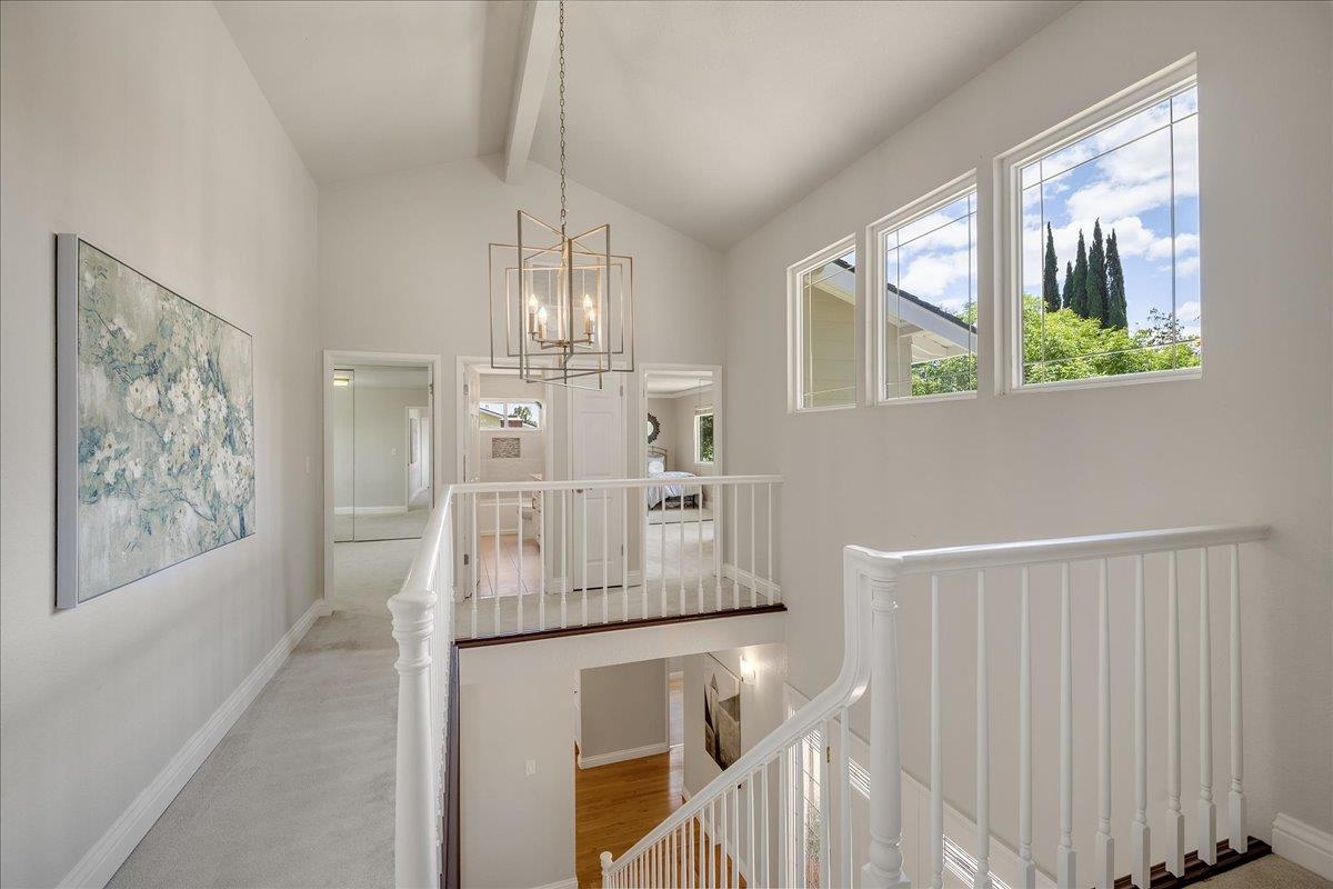 1204 Lubich Drive Mountain View, CA 94040 - Photo 17 of 39 a room with stainless steel appliances wooden floor and chandelier