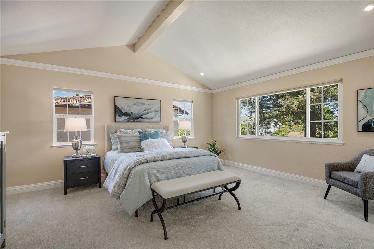 1204 Lubich Drive Mountain View, CA 94040 - Photo 18 of 39 a spacious bedroom with a bed and a window