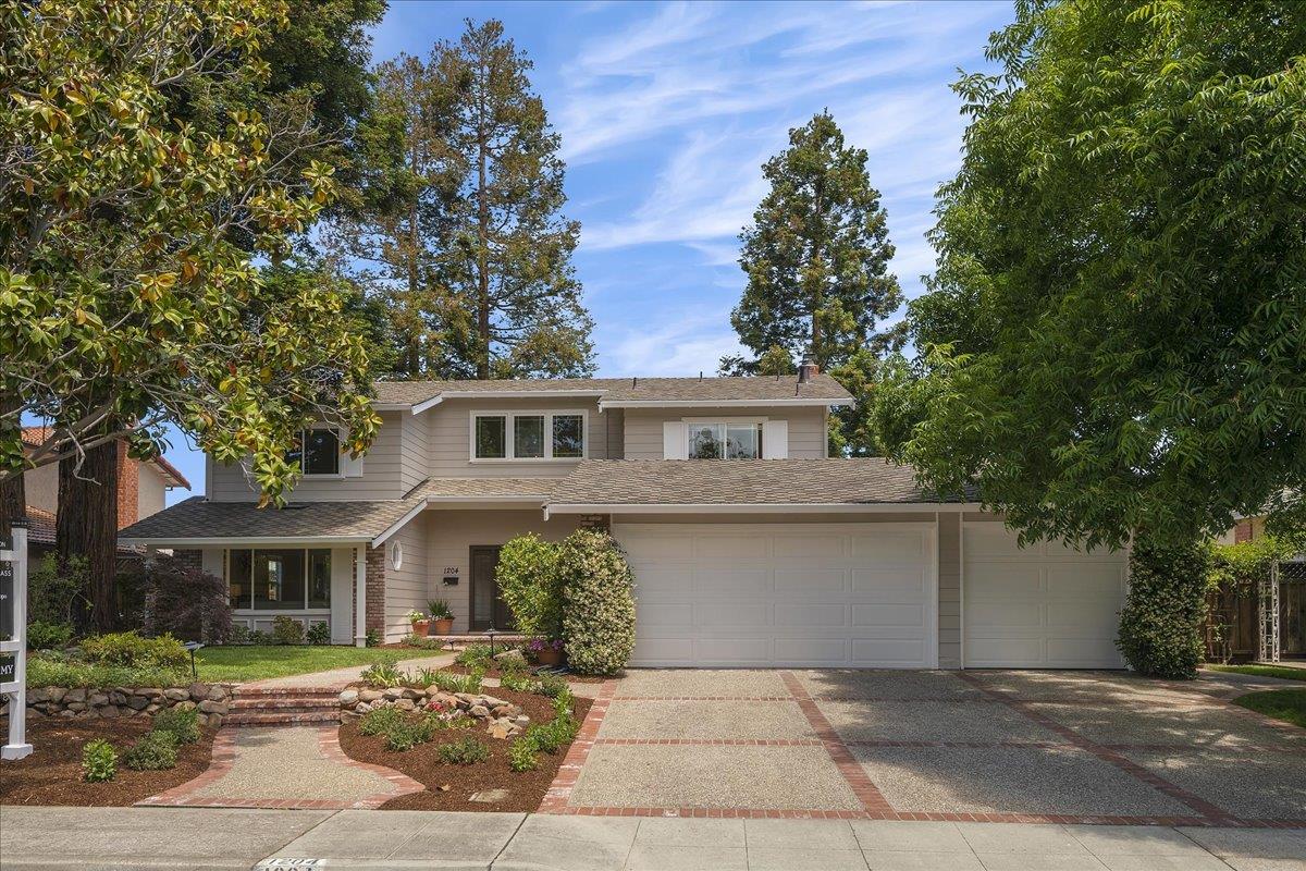 1204 Lubich Drive Mountain View, CA 94040 - Photo 2 of 39 a front view of a house with a garden