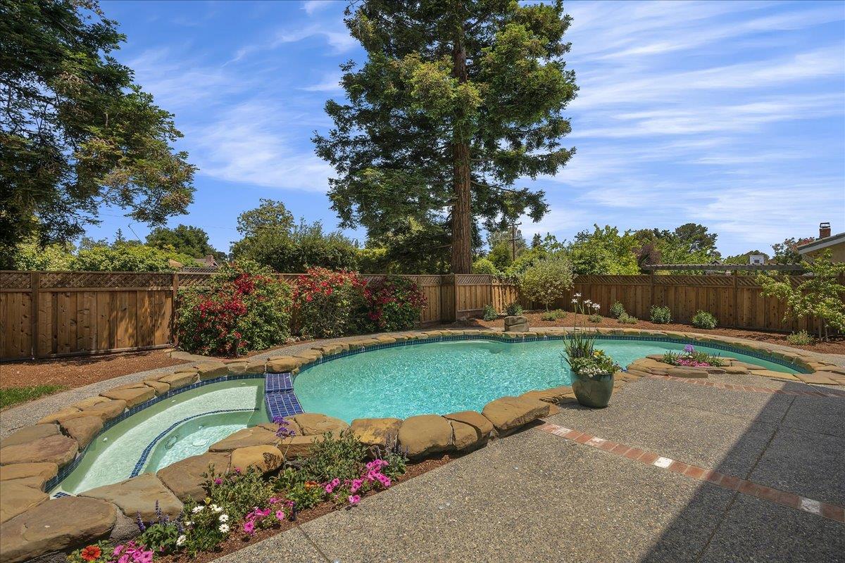 1204 Lubich Drive Mountain View, CA 94040 - Photo 31 of 39 a view of a backyard with seating area and trees