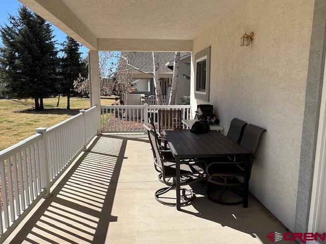 440 Southeast Old Goat Trail Cedaredge, CO 81413 - Photo 13 of 13 a view of a balcony dining area with furniture