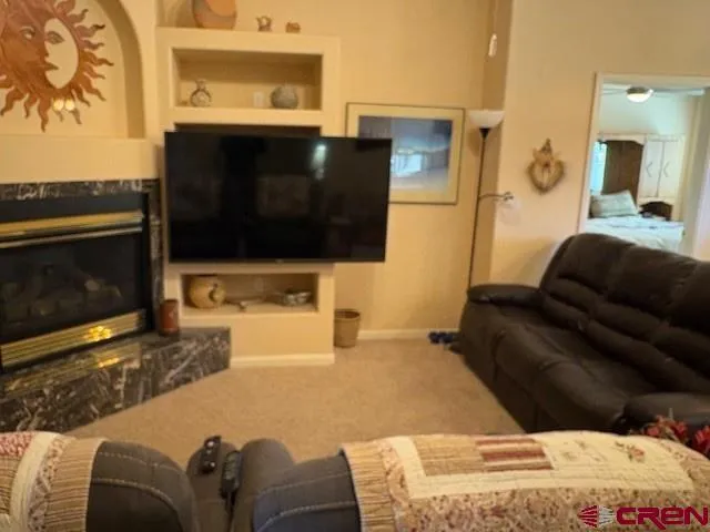 a living room with a couch and a flat screen tv